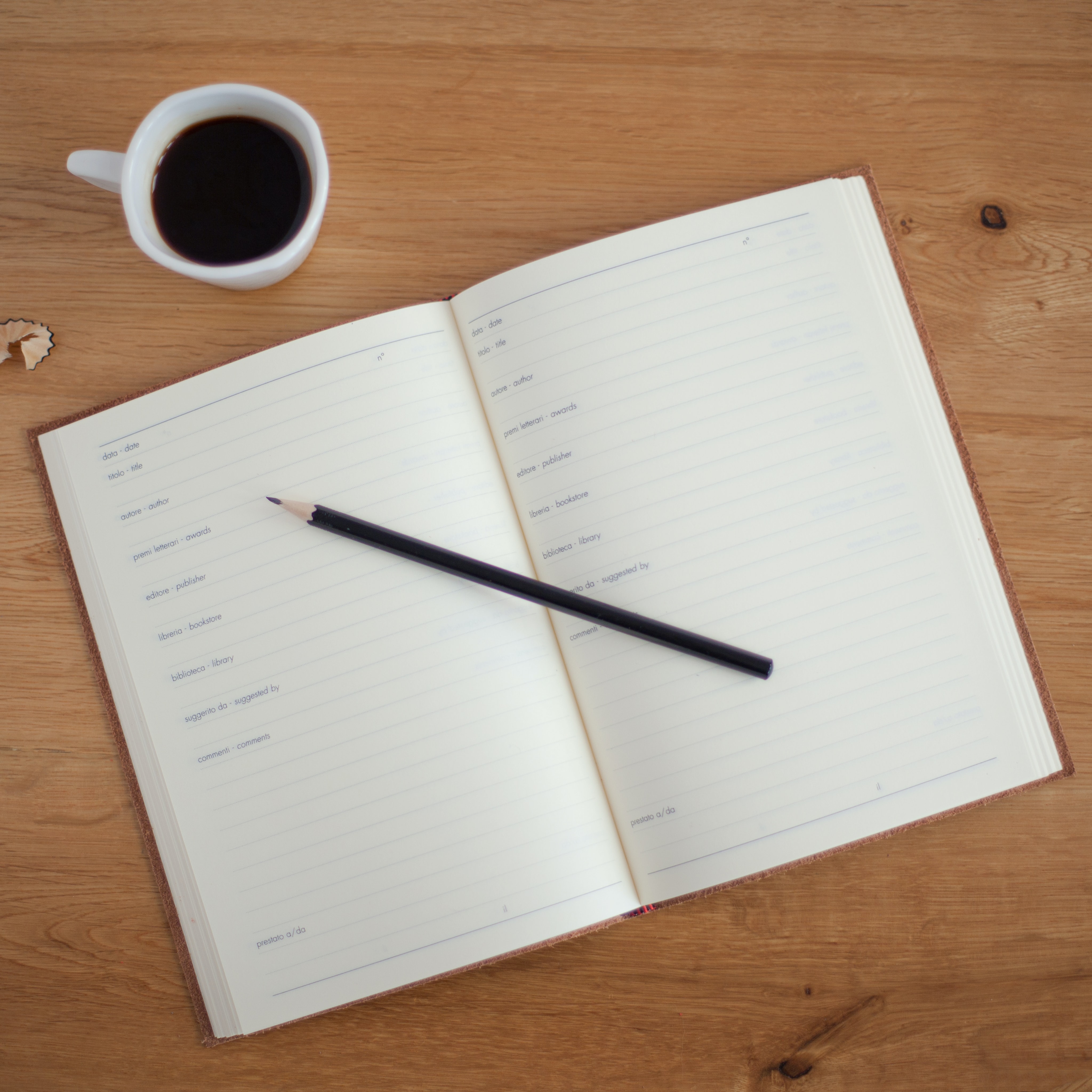 Picture of diary with coffee on the table